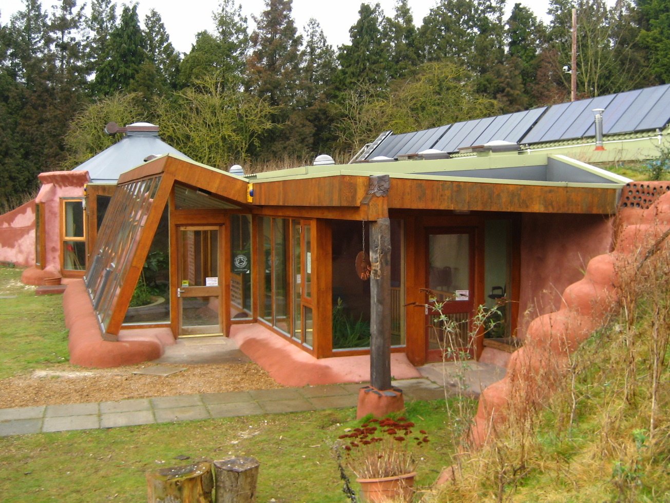 Earthship exterior demonstrating organic integration with the surrounding landscape